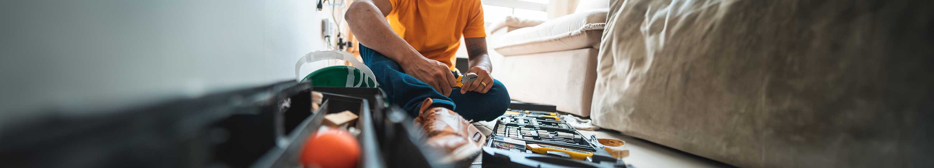 contractor sitting with open tool box